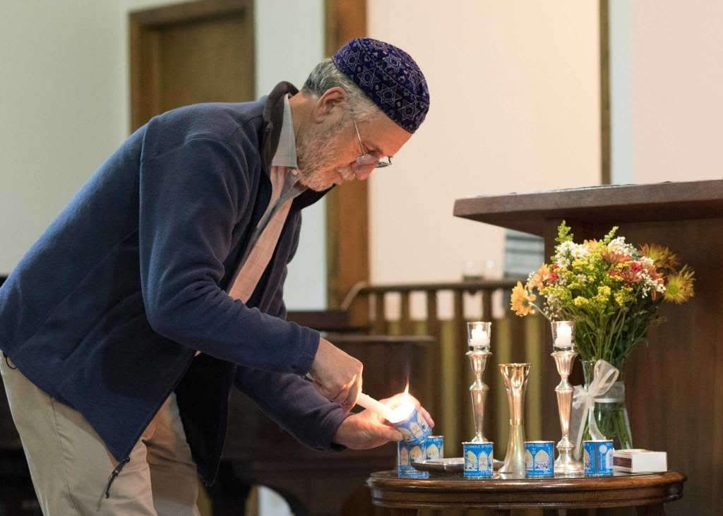 President Jay Adler lighting Memorial Candles
